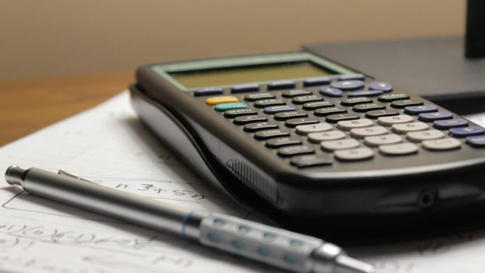 AI invoice processing illustrative calculator and invoice paperwork