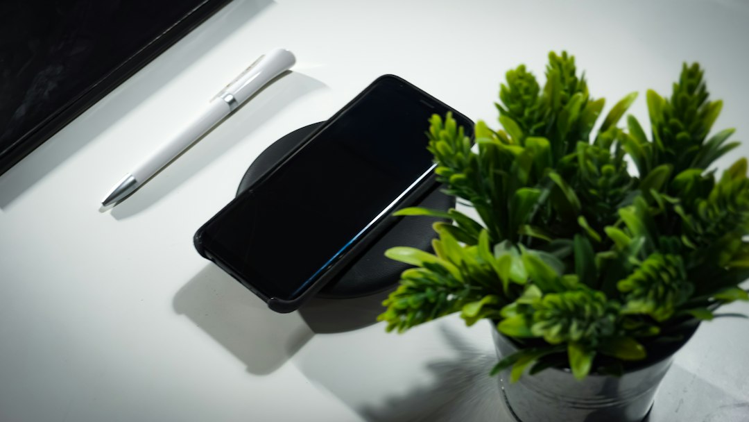 Amazon Bee Eclipse phone-mounted AI assistant concept with a smartphone