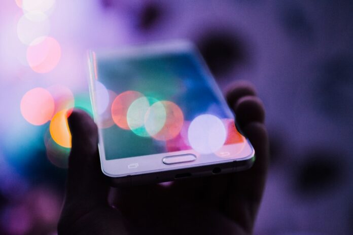 Illustrative smartphone and digital interface representing ChatGPT visual ads during image generation
