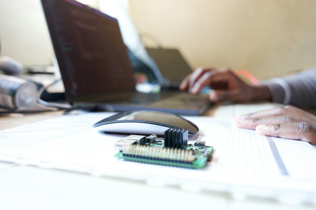Small circuit board and laptop illustrating Meta Muse Home Link and smart home AI hardware